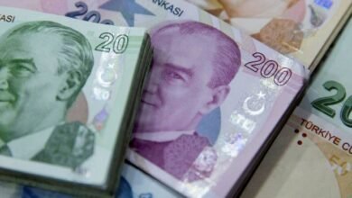 Turkey’s lira record low Erdogan defends rate cuts